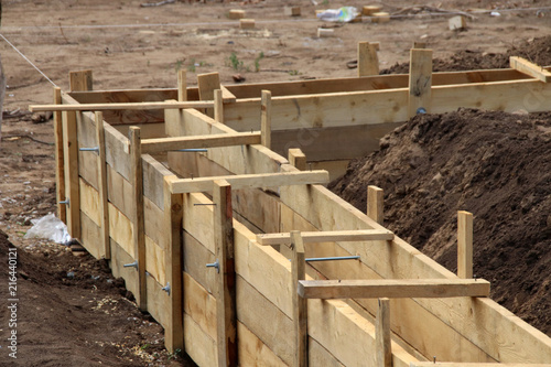 Wooden formwork concrete strip foundation for a cottage