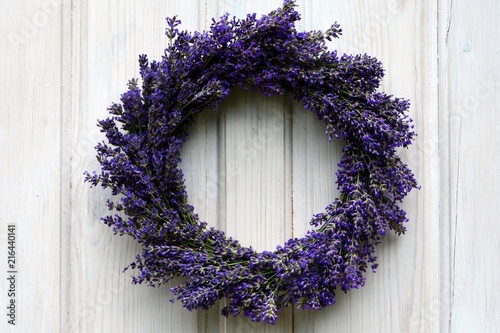 Lavender wreath on an old white wooden door.