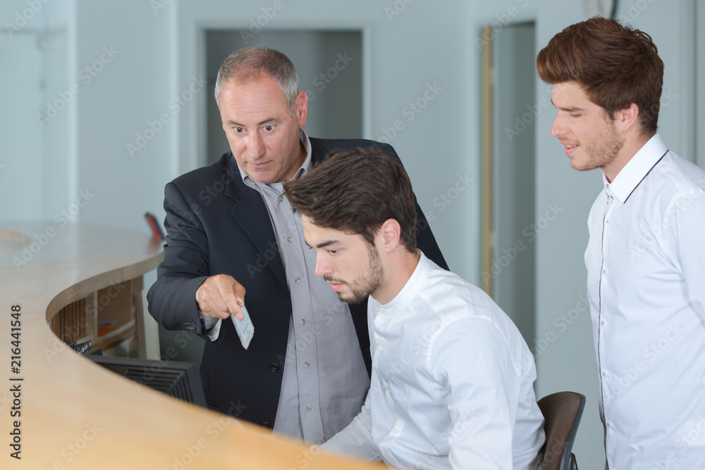 manager with apprentices in hotel reception manager with apprentices in hotel reception