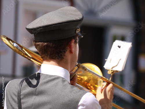 marching muscian with a slide trombone photo