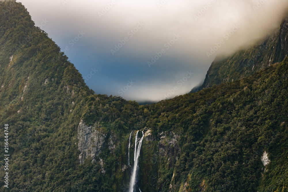 Beautiful landscape of Stirling waterfall at Milford sound. Fiordland National Park in New Zealand.