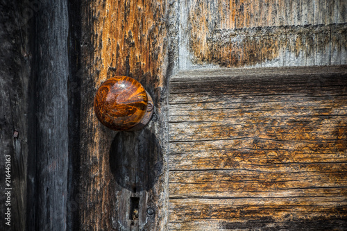 Old wooden door with wooden knob