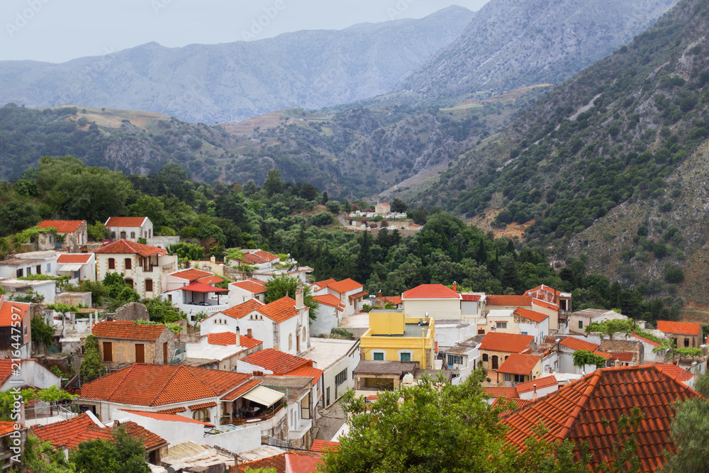 White houses with red roofs in the mountains, Argiroupolis, Crete