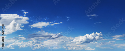 Summer blue sky with fluffy clouds
