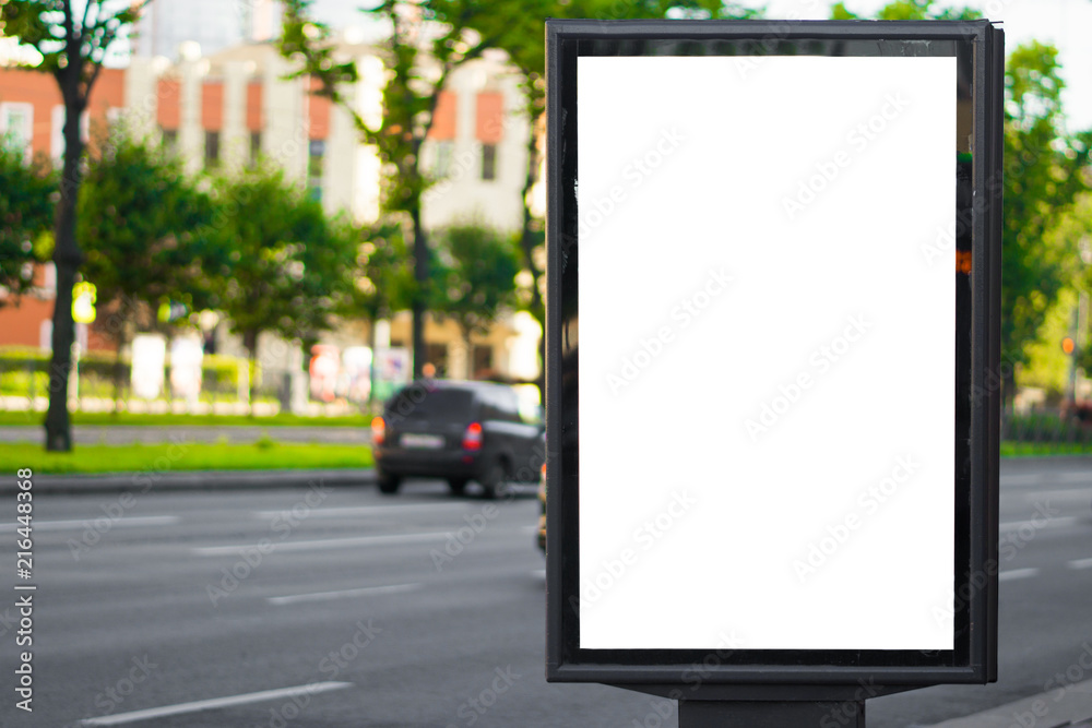 Blank advertising panel on a street in the afternoon near the road Blank advertising panel on a street in the afternoon near the road