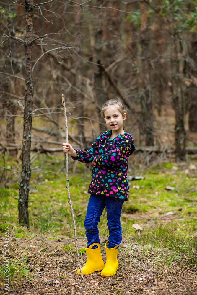 Children walk in the forest with canes. Children walk in the forest with canes.