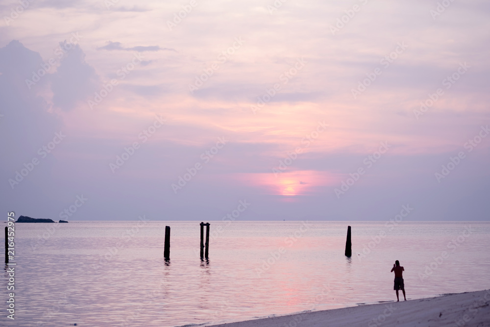 Fototapeta premium Beautiful of sunrise with colorful sky in summer time concept travel, holiday and vacation. Tropical paradise beach nature landscape at Lipe island in Thailand.