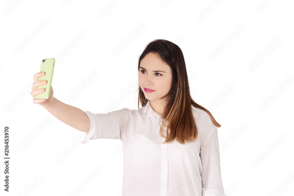 Young woman taking selfie with smartphone Young woman taking selfie with smartphone