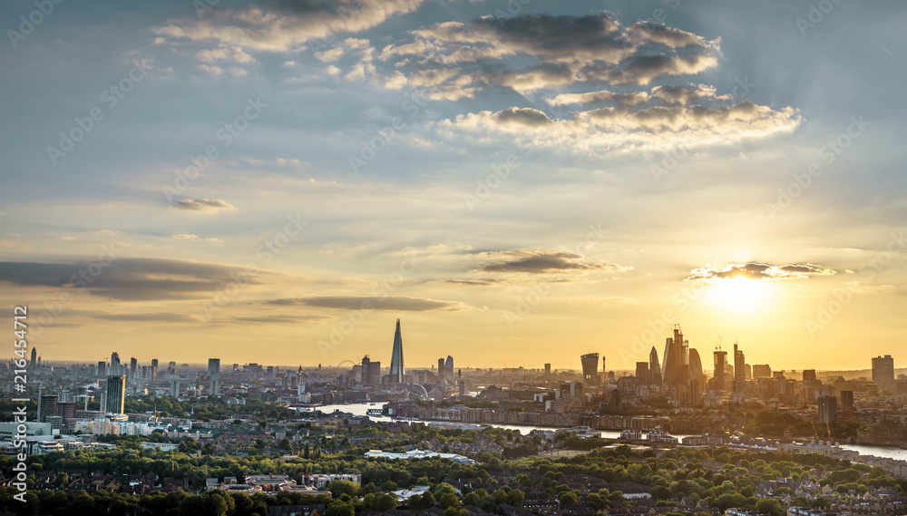 London skyline at sunset including Tower Bridge and skyscrapers
