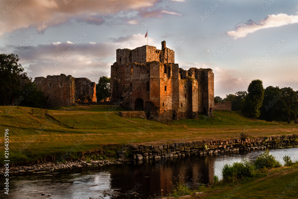 Spectacular view of the ruins of Brougham Castle and stream at sunset in Cumbria, England UK.