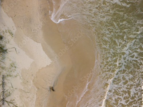 Aerial view of waves at sunset