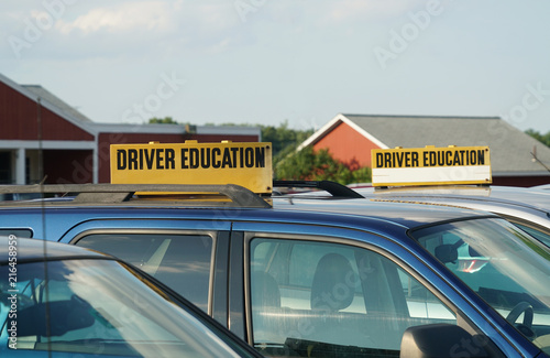 close up on driver school cars with sign on top