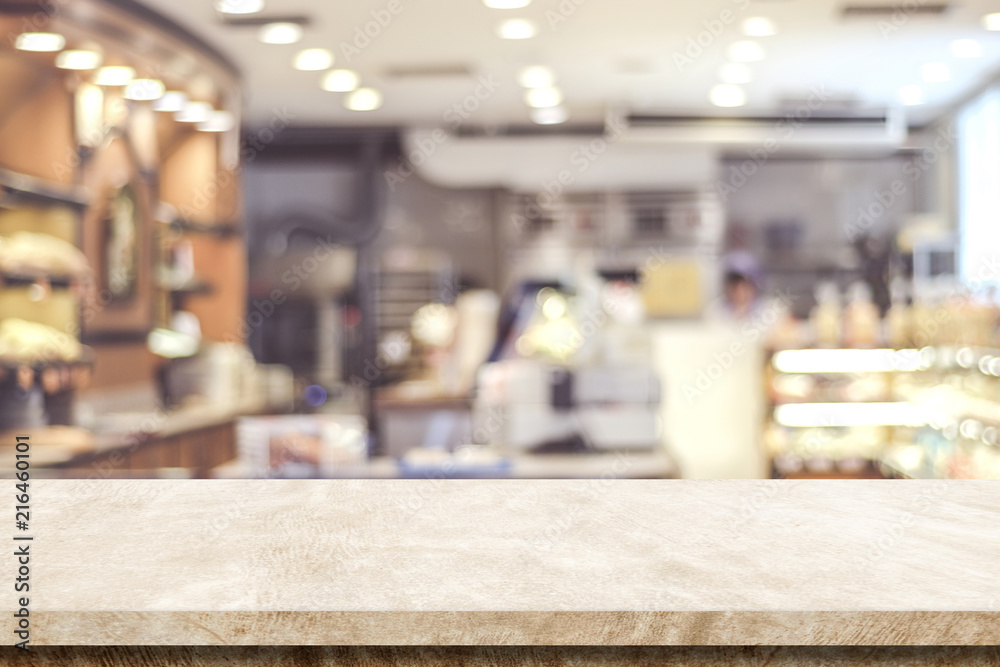 Empty brown cement table over blur cafe background, product and food display montage Empty brown cement table over blur cafe background, product and food display montage