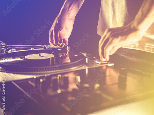 close up vintage look of dj playing vinyl record music on the party