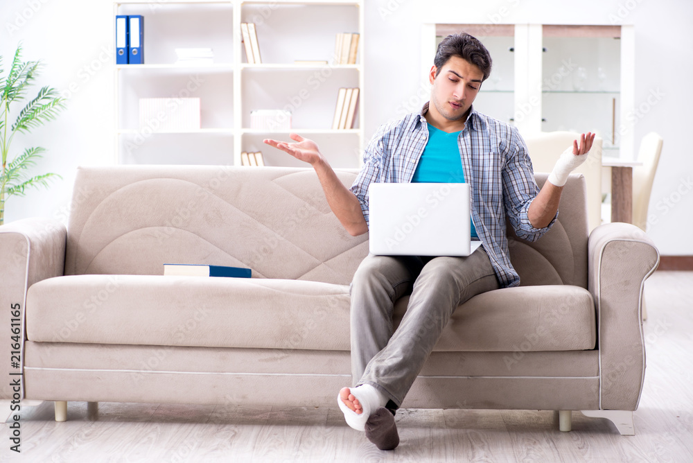Young student man with injury at home Young student man with injury at home