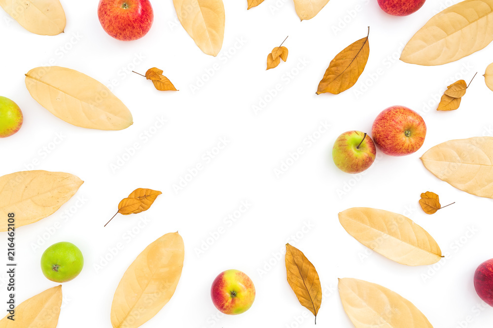 Thanksgiving composition. Frame of autumn dried leaves and apple fruits on white background. Flat lay, top view, copy space