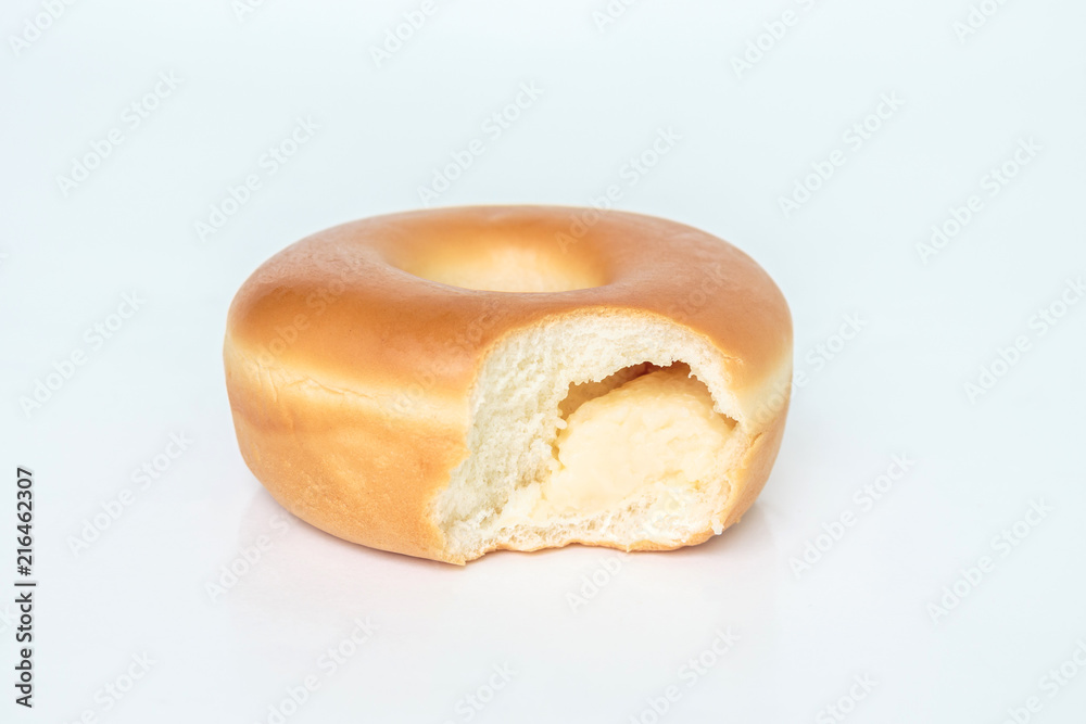 Bite marks on donuts on white background Bite marks on donuts on white background