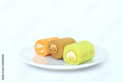 green chocolate orange cake roll on white placed on white background.