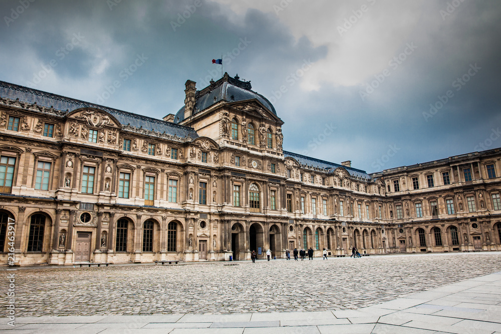 Fototapeta premium The Louvre Museum in a freezing winter day just before spring