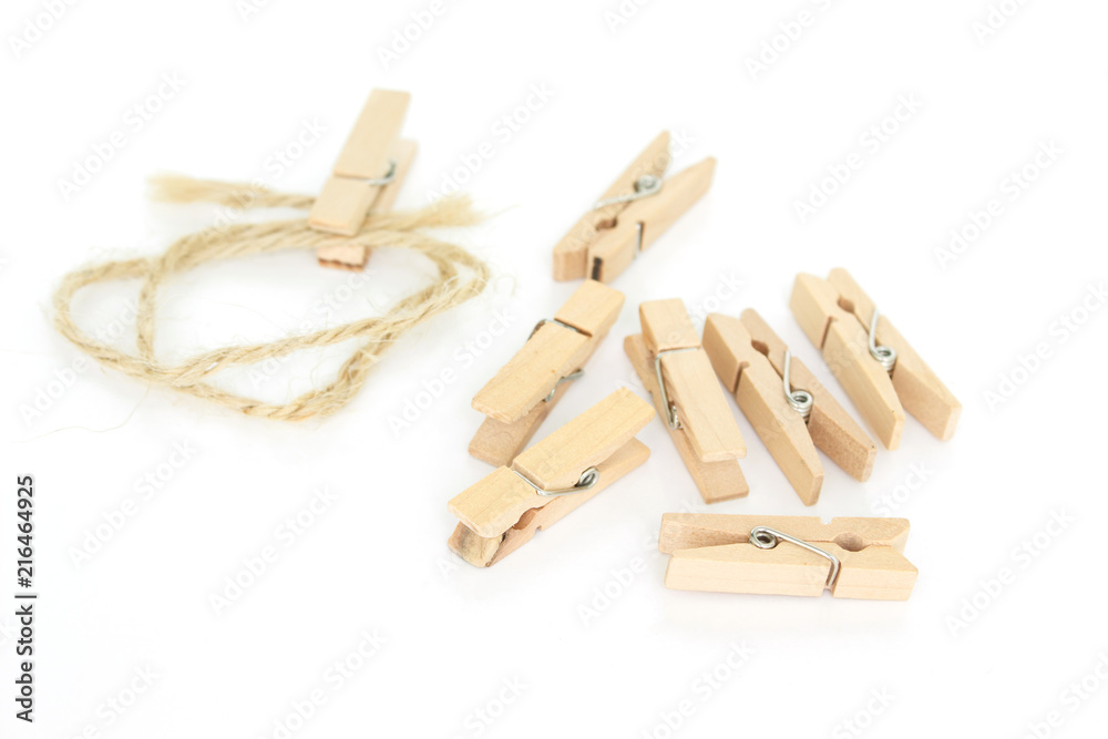 clothes pin and brown rope on white background. clothes pin and brown rope on white background.