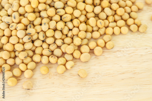 soy bean pile on wooden  background top view.