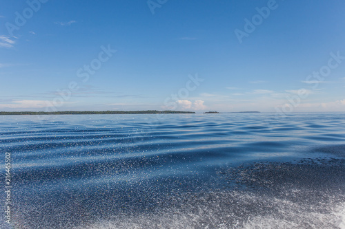 Cumulus white clouds over the water surface of Ladoga Lake. Karelia. 