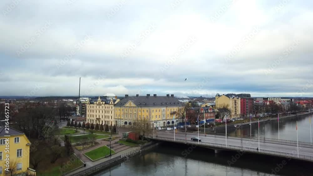 Aerial panoramic view of Norrkoping, Sweden. Drone shot flying over of the city buildings, bridge and the river Motala strom. Aerial panoramic view of Norrkoping, Sweden. Drone shot flying over of the city buildings, bridge and the river Motala strom.