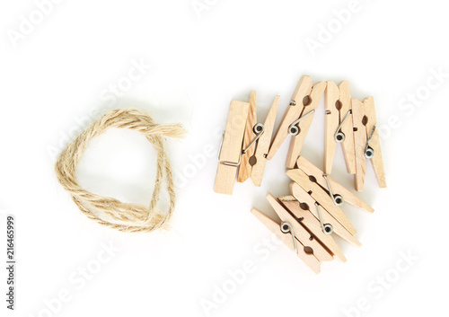 clothes pin and brown rope on white background.