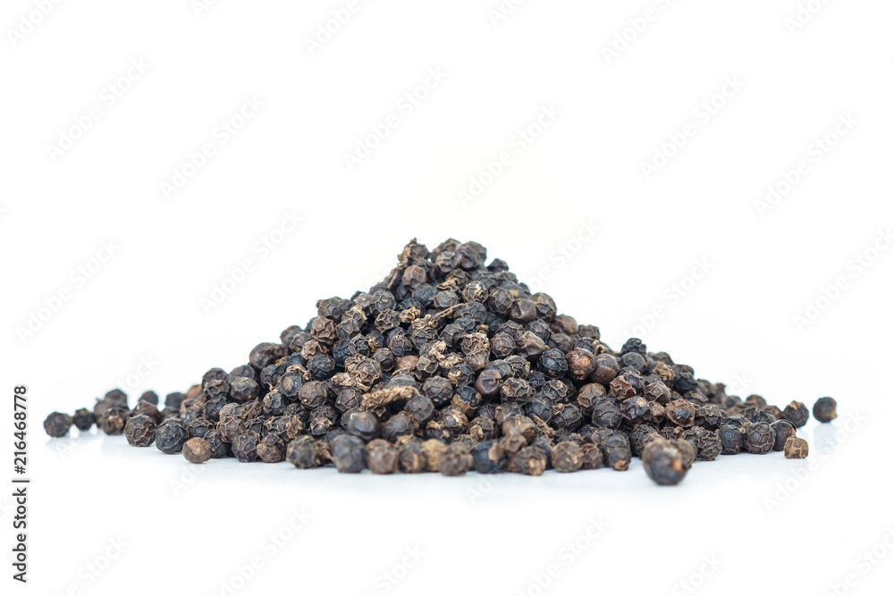 black peppercorns heap on white background. black peppercorns heap on white background.