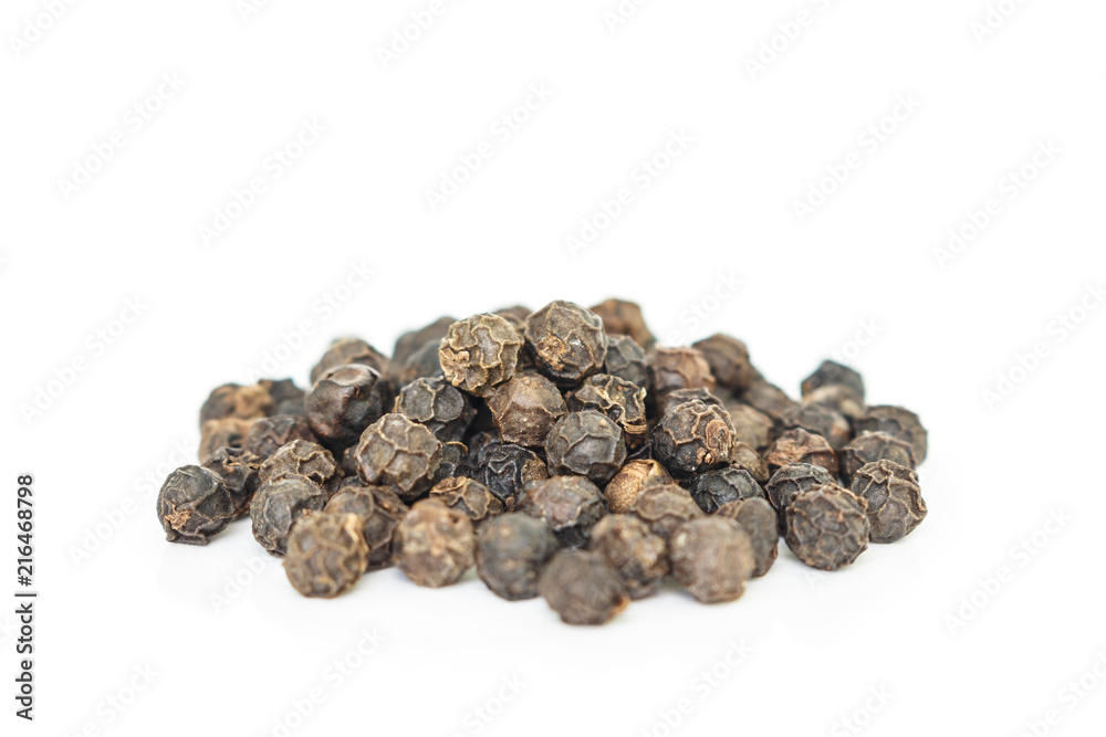 black peppercorns heap on white background. black peppercorns heap on white background.