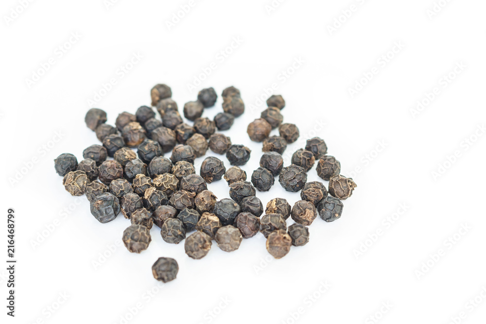 black peppercorns heap on white background. black peppercorns heap on white background.