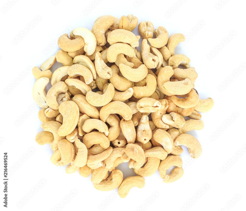 heap cashews top view on white background. heap cashews top view on white background.