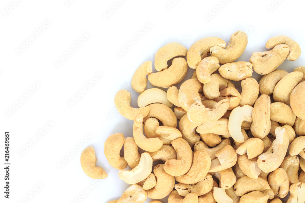heap cashews top view on white background. heap cashews top view on white background.