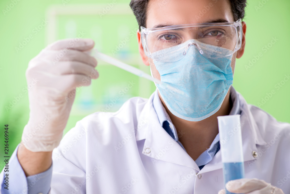 Man chemist working in the lab Man chemist working in the lab