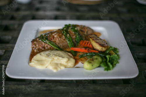 tuna steak with mashed potato and grilled vegetable
