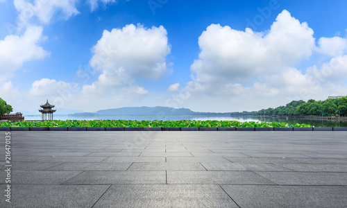 Fototapeta Naklejka Na Ścianę i Meble -  Empty square floor and hangzhou west lake natural scenery