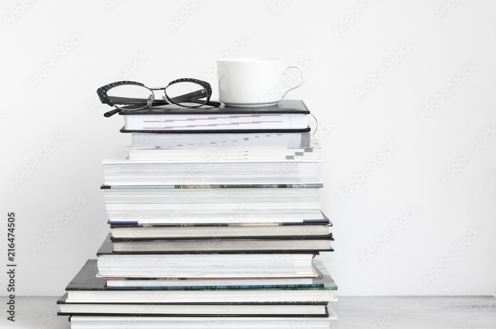 Cup of coffee on stack of books Cup of coffee on stack of books