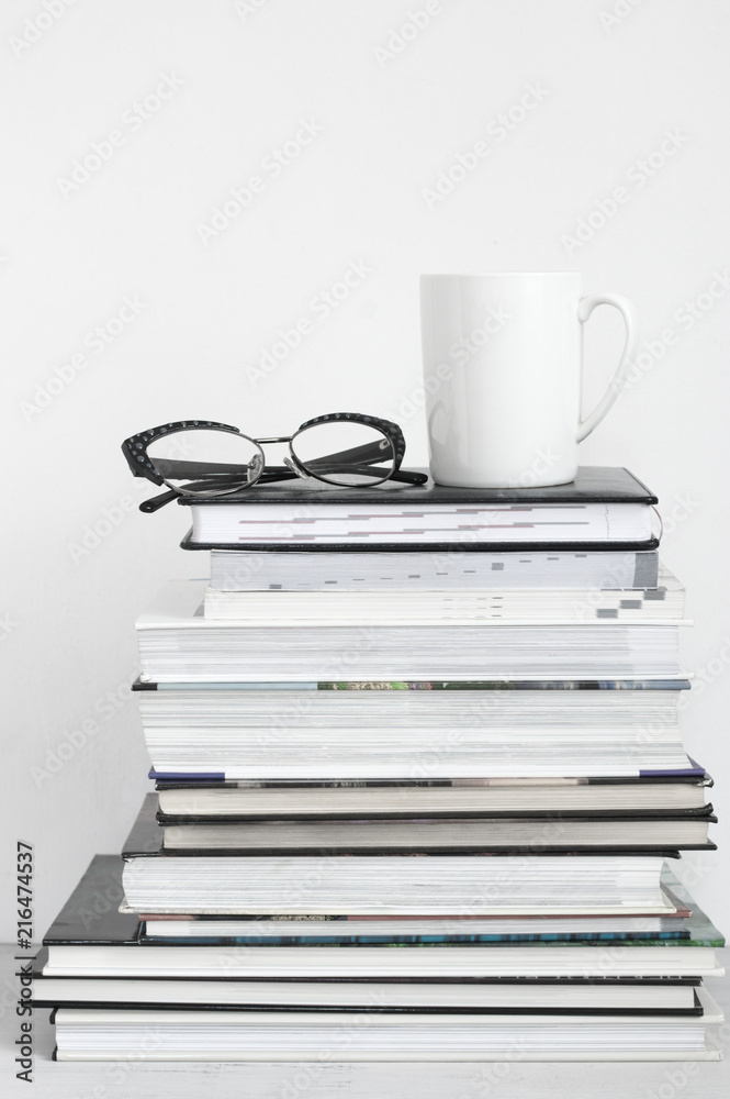 Cup of coffee on stack of books Cup of coffee on stack of books