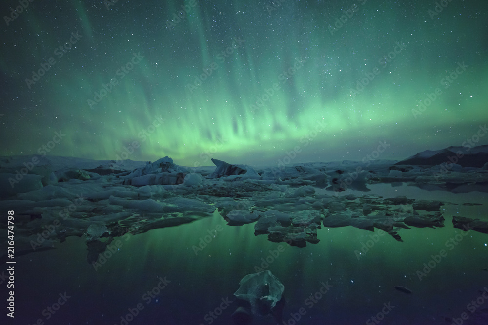Northern Lights over glacier lagoon in Iceland. Up north northern lights show.