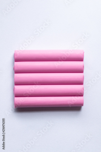 polymer clay handcraft for kids . line stick toy pattern product design . pink pastel colorful , minimal style .