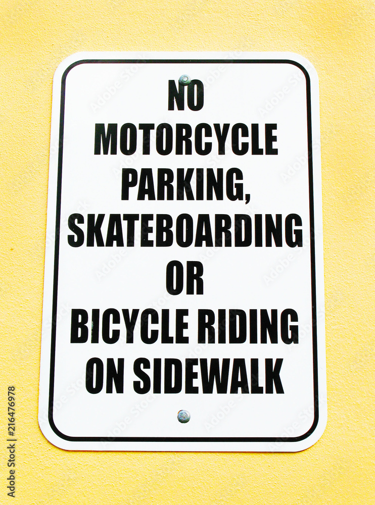 No Mortorcycle Parking Skateboarding or Bicucle Riding on Sidewalk Sign No Mortorcycle Parking Skateboarding or Bicucle Riding on Sidewalk Sign