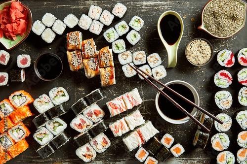 High angle view of variety of sushi server with sauces