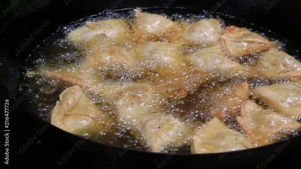 Vegetarian fried samosa, traditional Indian food, street food in Bali, Indonesia. Close up