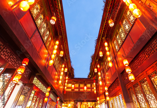 Red lanterns hang on ancient buildings in the evening, in Chengdu, Sichuan, China.