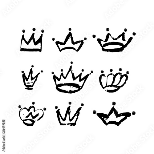 Hand drawn crown icon set in black color. Ink brush crowns background.