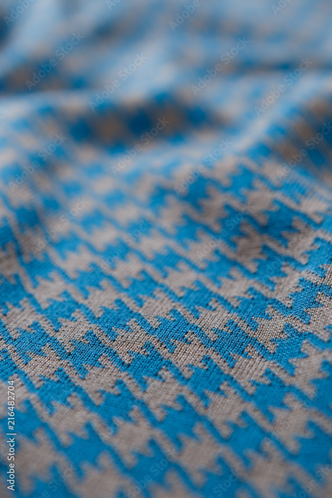 Fototapeta premium Close-up textile pattern in blue and grey colors as background