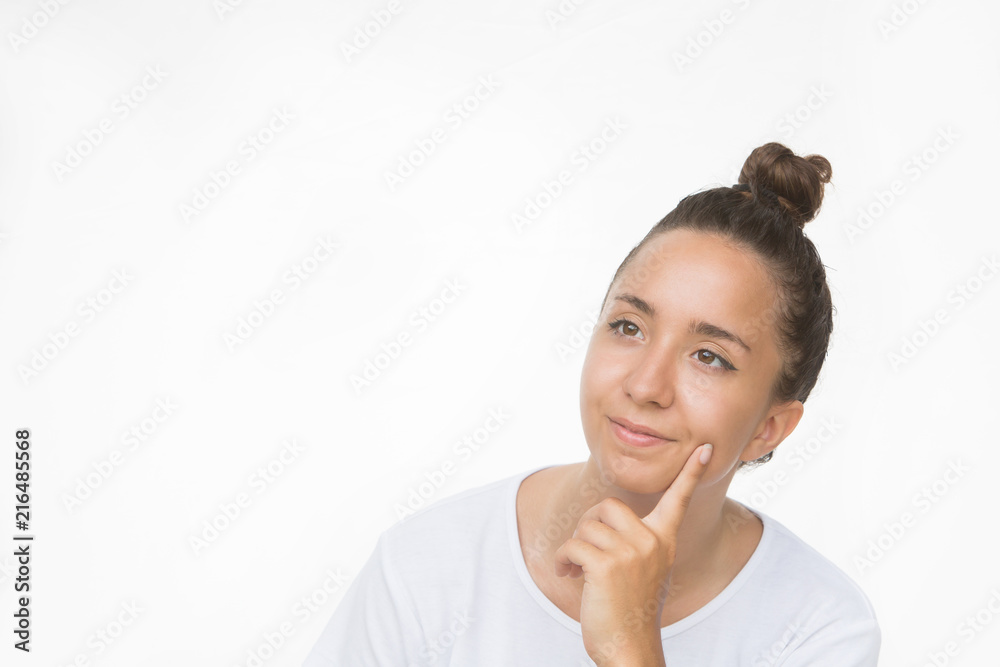 Pretty positive curious young woman thinking looking up to empty copy space. Emotional girl isolated over white Pretty positive curious young woman thinking looking up to empty copy space. Emotional girl isolated over white