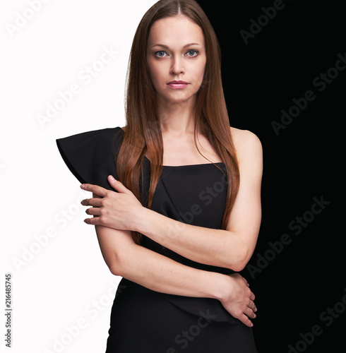 pretty woman with long brown hair in black dress
