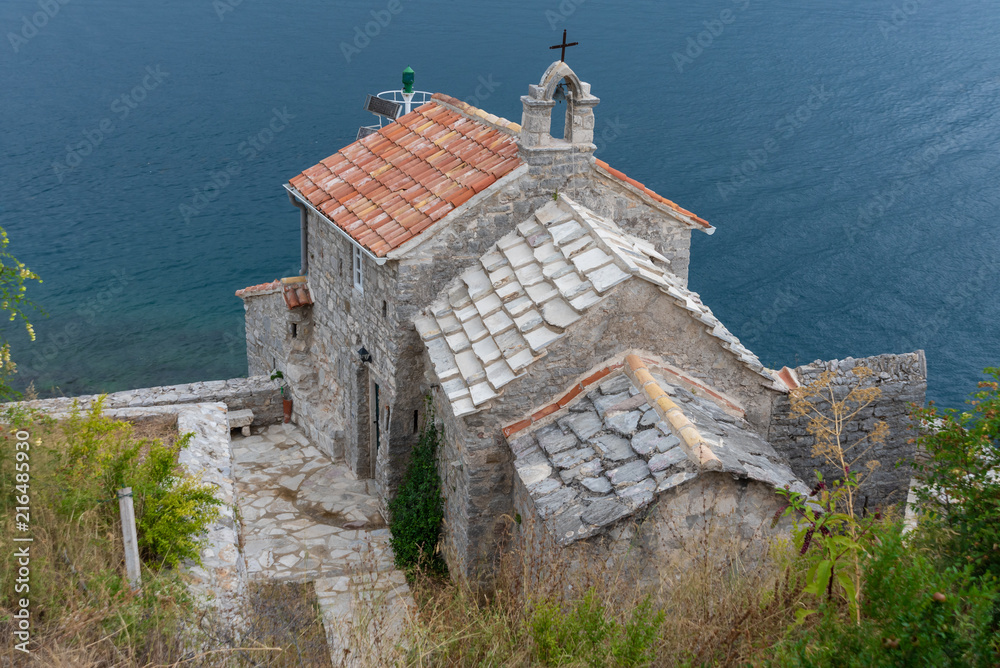 old medieval stone church by the sea