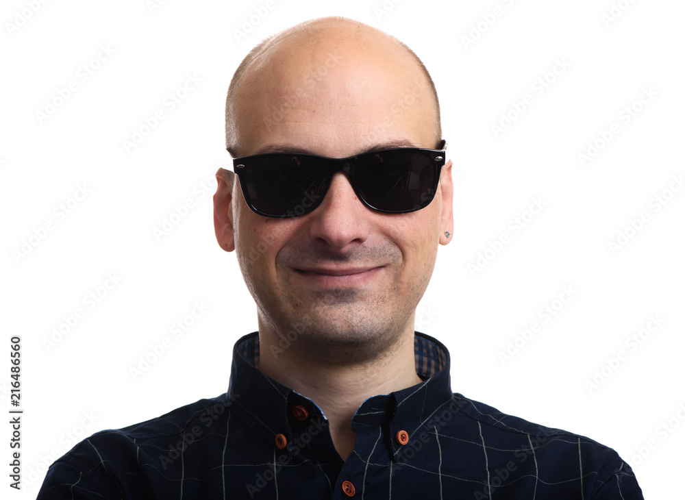 Bald man wearing sunglasses isolated Bald man wearing sunglasses isolated